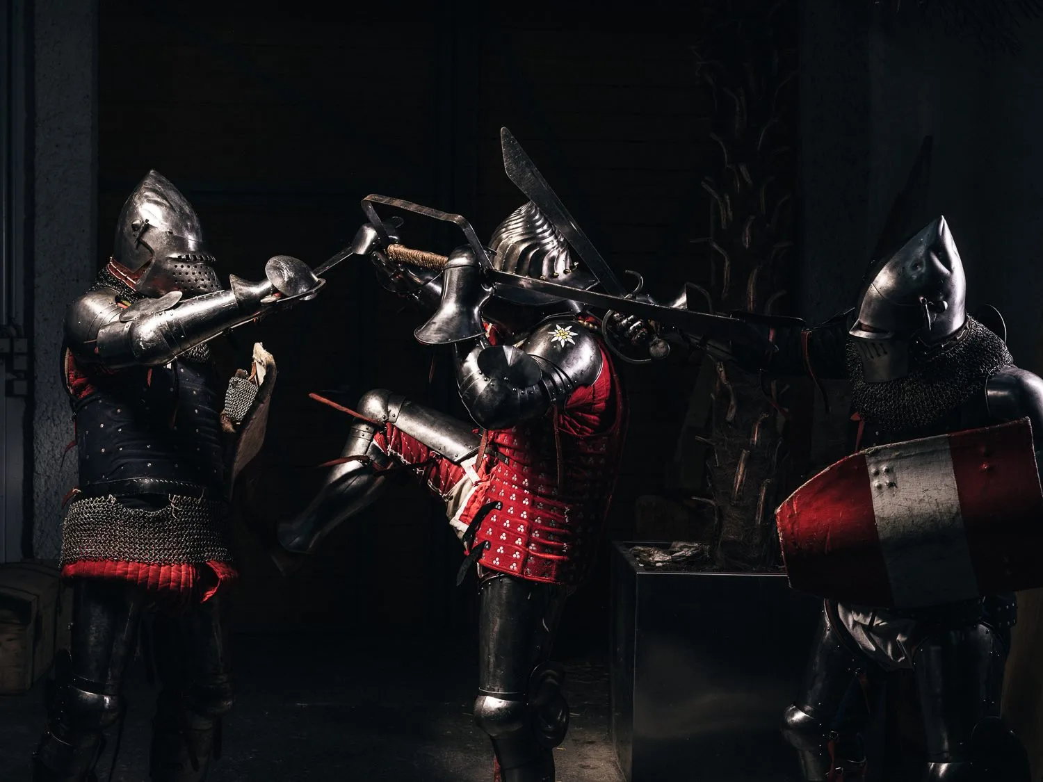 a group of men in armor holding swords