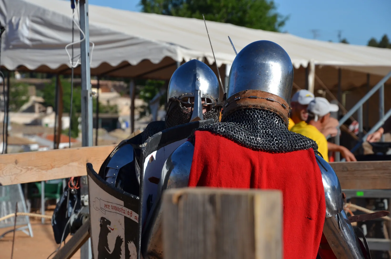 two people wearing armor and helmets