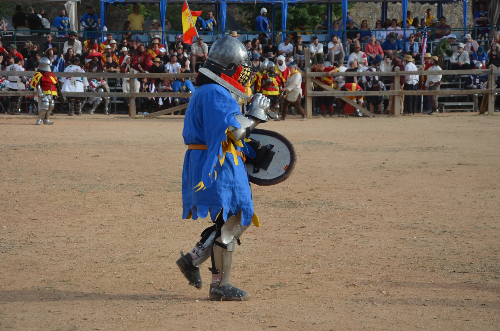 a man in a garment with a shield and sword